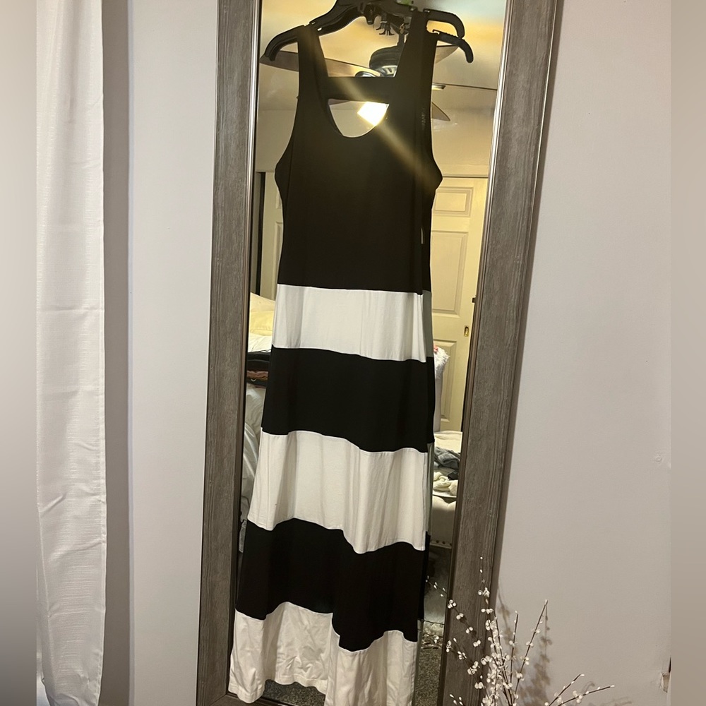 Black and white striped maxi dress with back out and side split. Never worn.